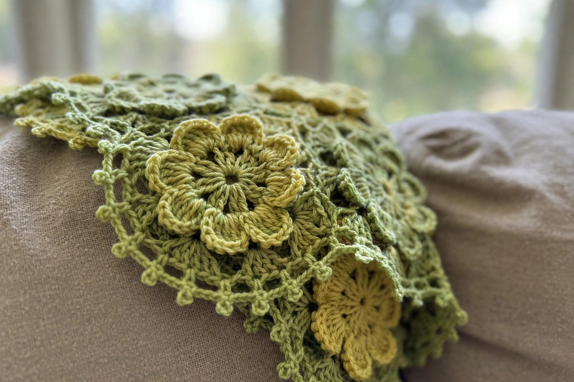 Close-up of the crochet flower motifs and picot edging on the floral square doily