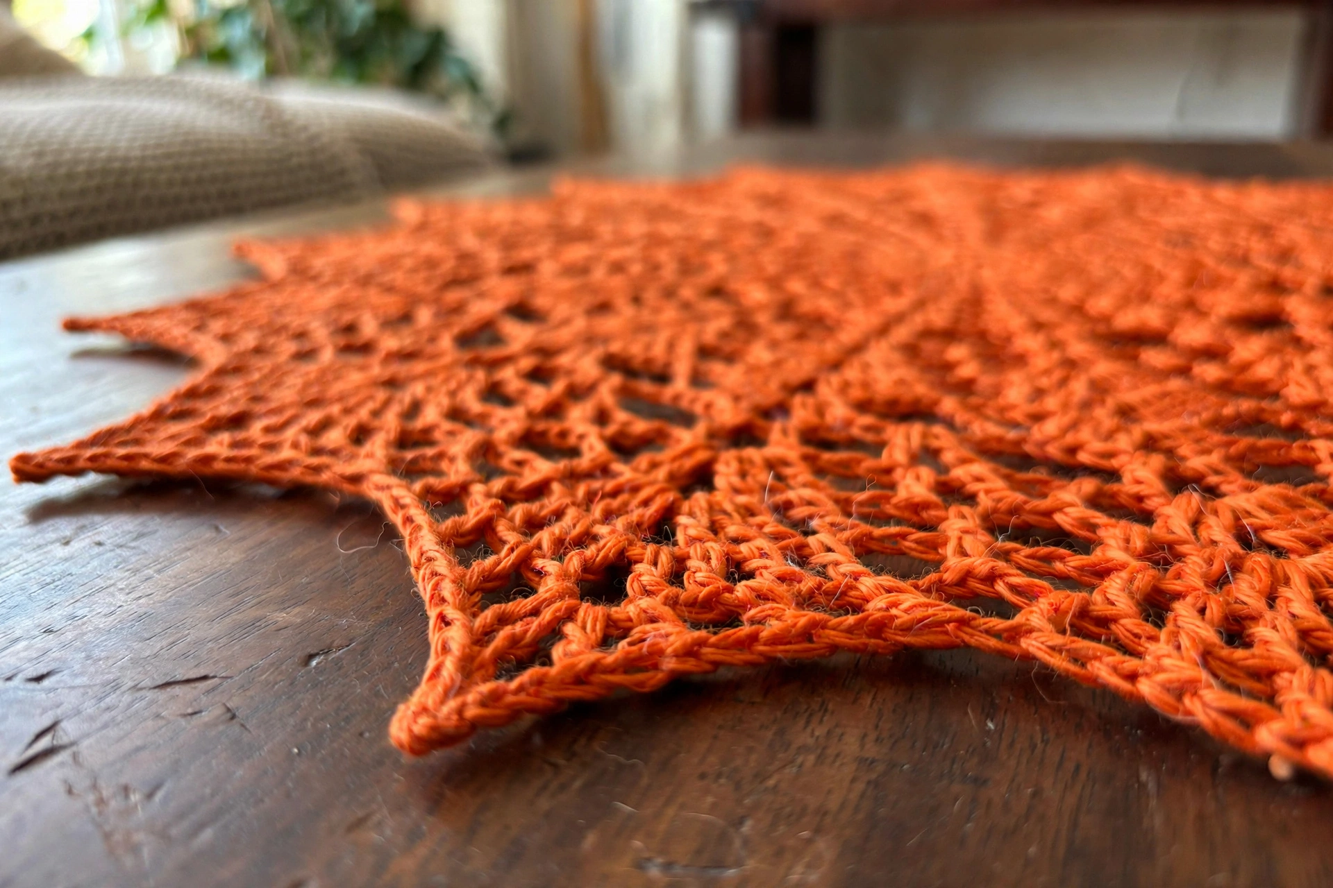 Close-up of the pointed star-like edge on the orange lace doily