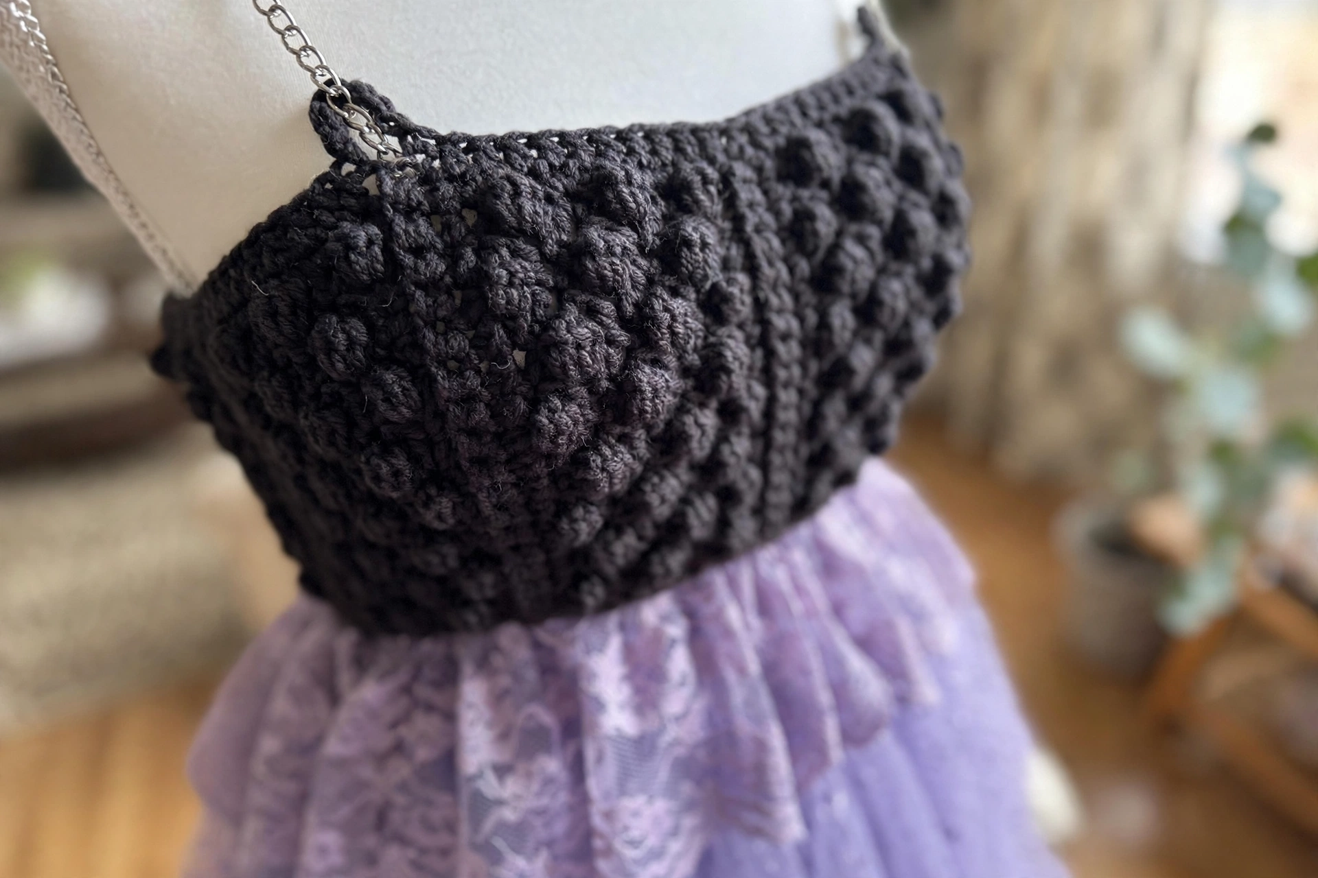 Close-up of the charcoal bobble-textured bodice of the moonlight silver fairy dress