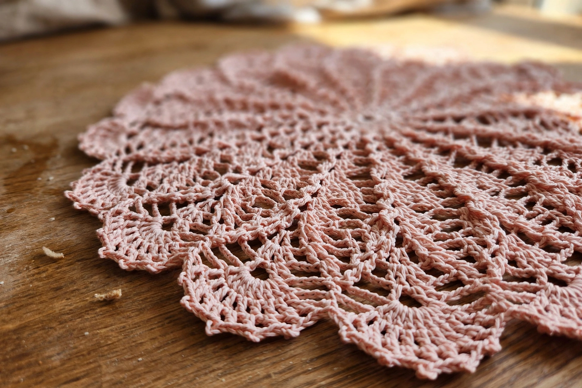 Close-up of the scalloped lace edge of the doily