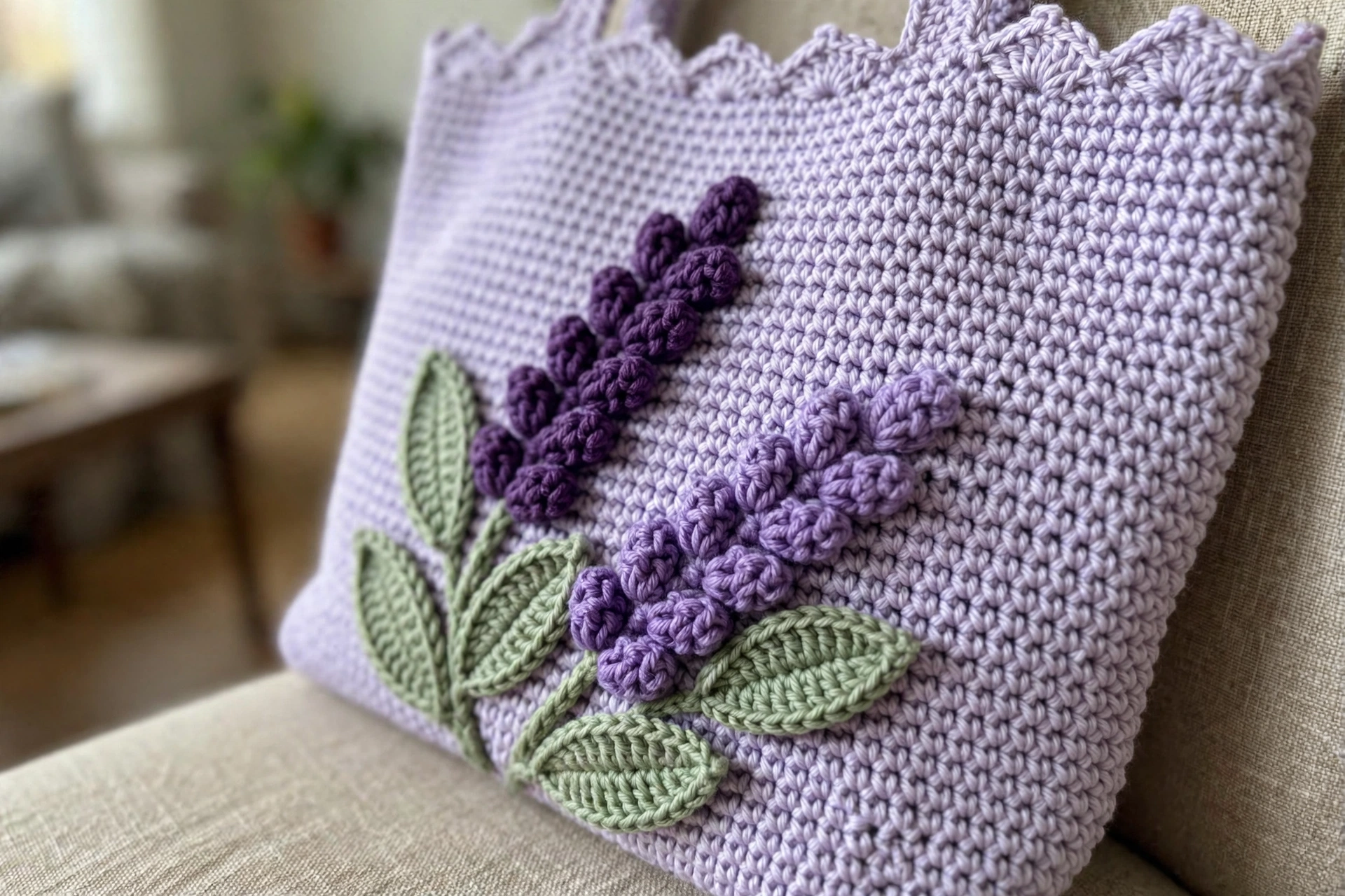 Close-up of the 3D bobble-stitch lavender sprigs with green leaves on the light-lavender crochet tote