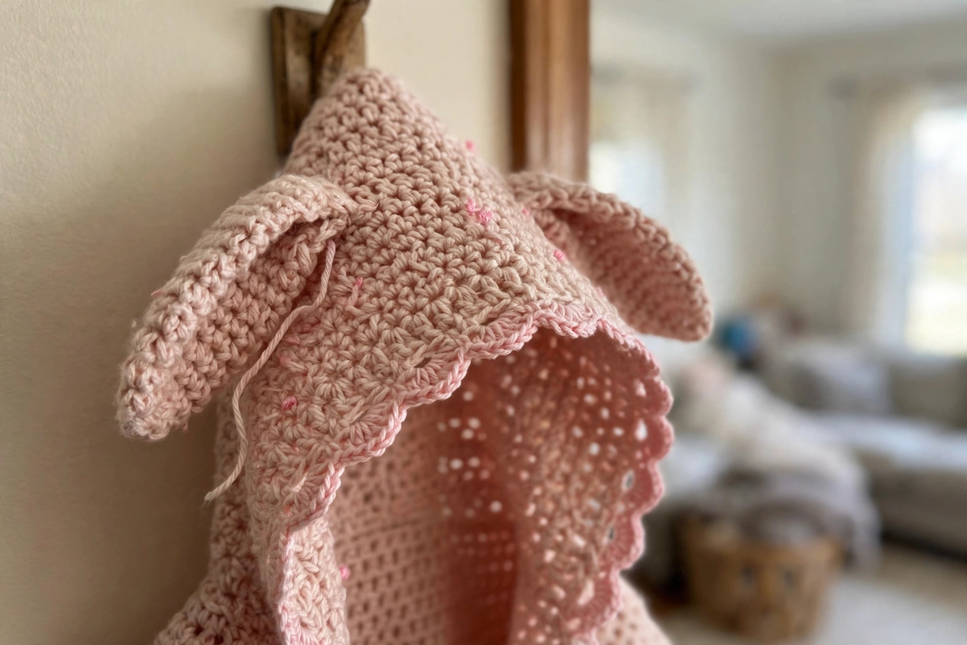 Close-up of the floppy bunny ears and scalloped edging on the coat hood